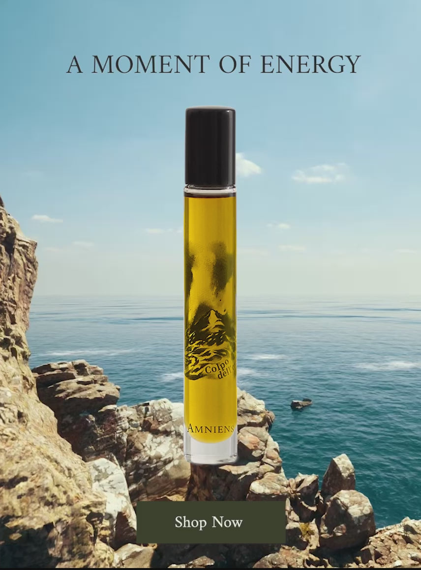 Colpo dell'onda scented oil overlay on video showing rocks and the ocean